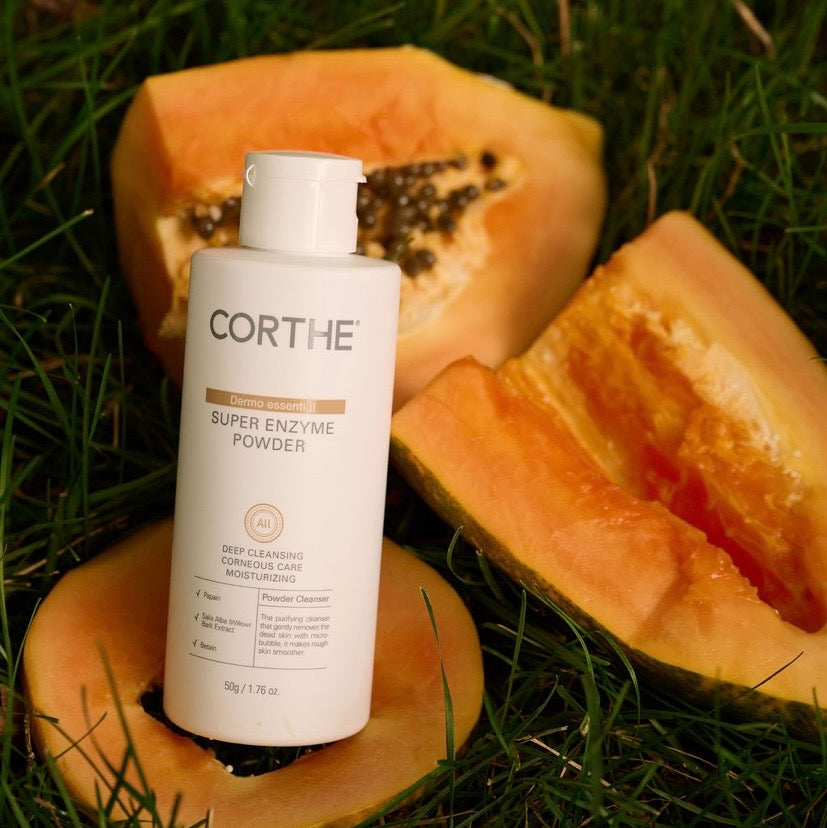 Travel-friendly Corthe Super Enzyme Powder; a spill-proof, powder-to-foam exfoliating cleanser that activates with water to detoxify pores and refine skin texture.