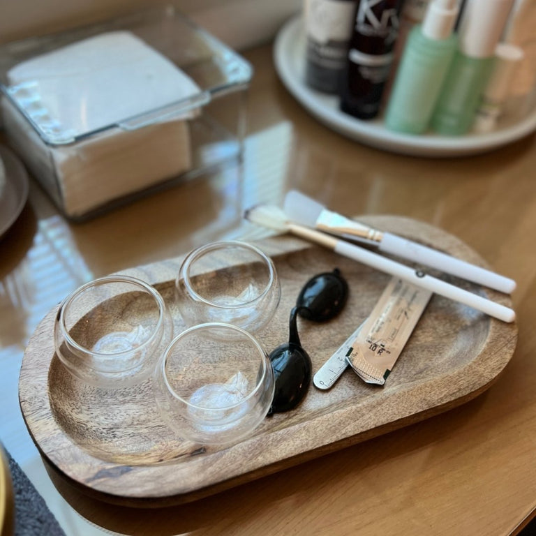 Aesthetic skincare setup featuring the Glass Mask Bowl and professional masking brushes for a spa-at-home ritual.
