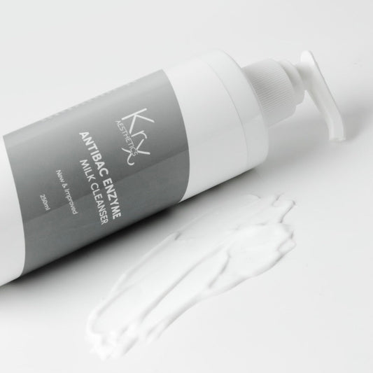 KrX Gentle Enzyme Milk Cleanser used as Step 1 of a double cleanse to dissolve waterproof SPF and makeup while using Papain enzymes to solve rough skin texture.
