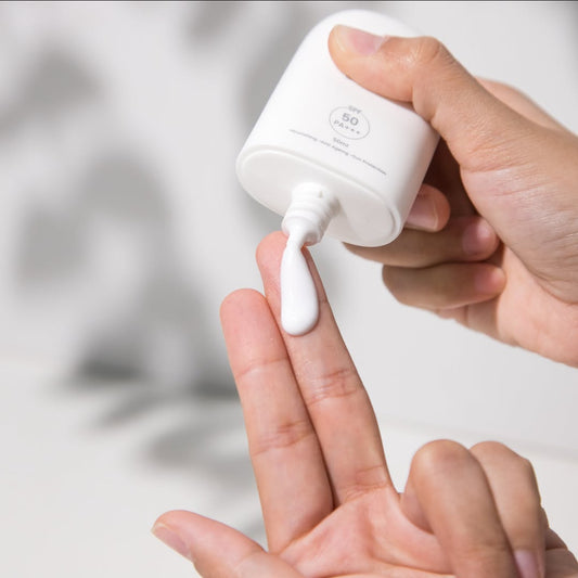 Applying the ultra-light Pfect-A serum sunscreen, an ideal non-greasy primer that layers flawlessly under makeup without pilling or oiliness.