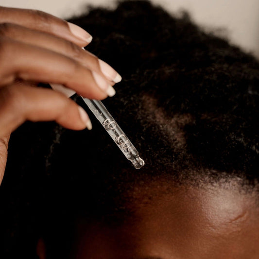 Applying BHF Korean Scalp Booster Ampoule directly to damp parted scalp to stimulate microcirculation with Caffeine, Menthol, and Centella Asiatica.