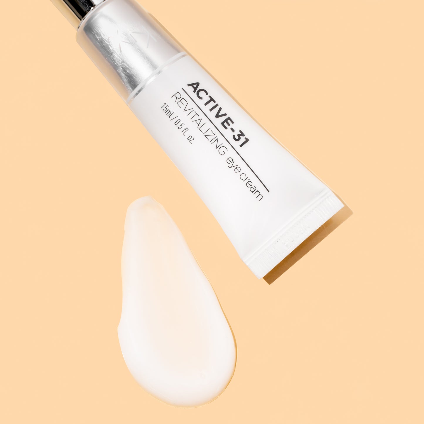 Lightweight and nutrient-dense: A texture swatch of the KrX Revitalizing Korean Eye Cream showing its fast-absorbing formula that utilizes Tremella Fuciformis for deep hydration.