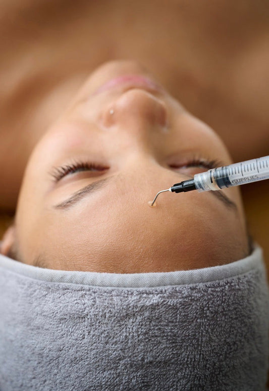 Professional application of PDRN treatment using a precision syringe for targeted skin regeneration and cellular repair.