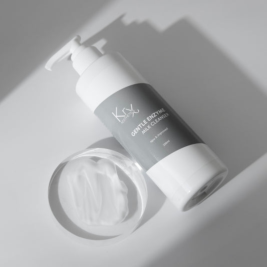 KrX Gentle Enzyme Milk Cleanser double cleanse routine featuring Papain enzymes; a non-abrasive solution that dissolves dead skin cell bonds to solve rough texture and dullness without the irritation of a scrub.