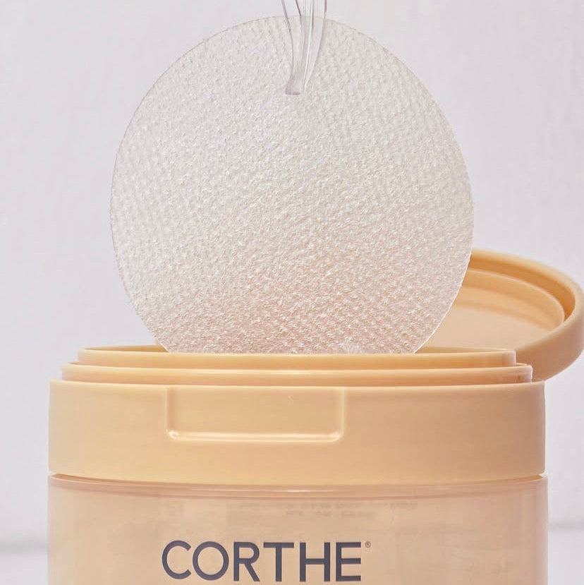 Close-up of the Corthe Collagen Gel Pad texture, showing the cooling herringbone pattern designed to grip the skin and deliver 11,000 ppb marine collagen for a plumping, anti-aging effect.