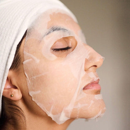 A model wearing the Corthe Calming Complexion Mask; a professional-grade Korean treatment that uses gentle AHAs to dissolve surface dullness and clear pores on sensitive, reactive skin.