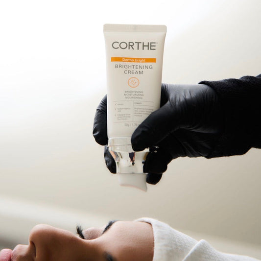 Medical grade hyperpigmentation treatment applying Corthe Brightening Cream in a skin clinic.