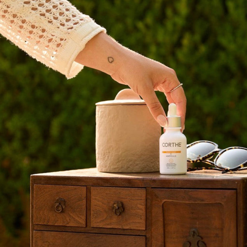 Applying Corthe Dermo Bright C Ampoule to improve skin clarity and restore a radiant, healthy glow to sensitive complexions.