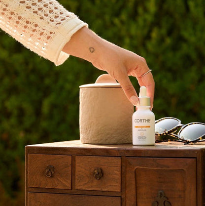 Applying Corthe Dermo Bright C Ampoule to improve skin clarity and restore a radiant, healthy glow to sensitive complexions.