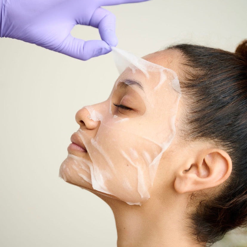 A professional skin therapist applying the Corthe Korean Calming Complexion Mask as a post-procedure treatment to reduce redness and replenish moisture after a clinical facial or peel.