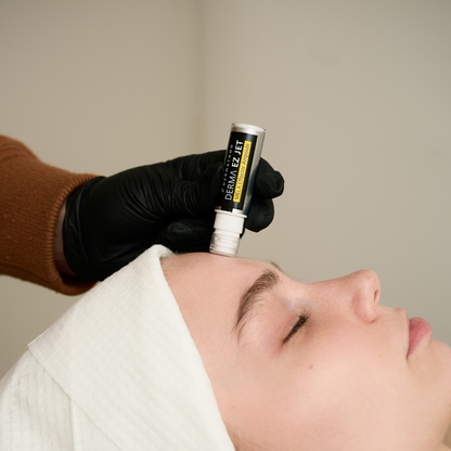 Dermathod EZ Jet Mela Effector being stamped on cheek for targeted dark spot and hyperpigmentation microchanneling treatment.