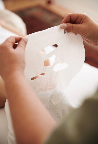 In-clinic facial treatment using Dermathod cooling sheet mask to reduce redness and inflammation after professional skincare procedures.