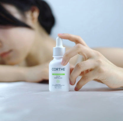 Gentle application of the Corthe Dermo Sensitive Ampoule on reactive skin; a lightweight, fragrance-free texture that provides instant cooling and soothing for rosacea and eczema-prone complexions. Professional Korean skincare.