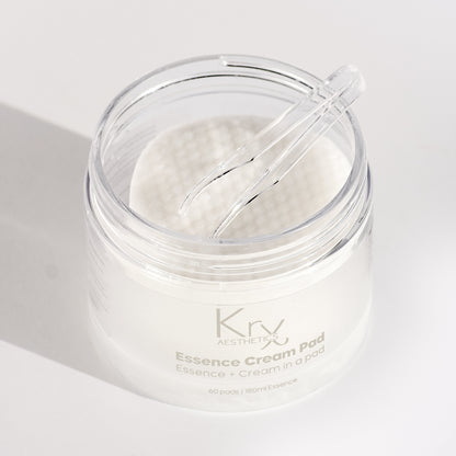 Close-up of KrX Korean Essence Cream Pads saturated in a rich, milky essence; designed to deliver the benefits of a toner, essence, and cream in one non-exfoliating step.
