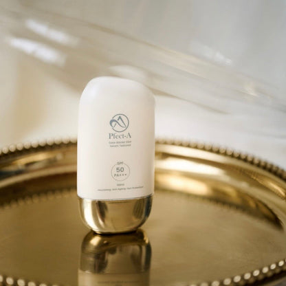 Pfect-A Solar Elixir Serum application; a professional Korean SPF 50 that mimics a hydrating face serum, absorbing instantly with zero white cast and a weightless feel.