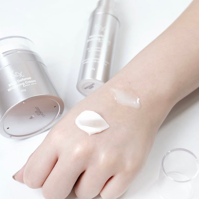 Texture of KrX Mela Defense Cream being applied to the skin to treat hyperpigmentation and uneven tone with clinical-grade Niacinamide and NPG.