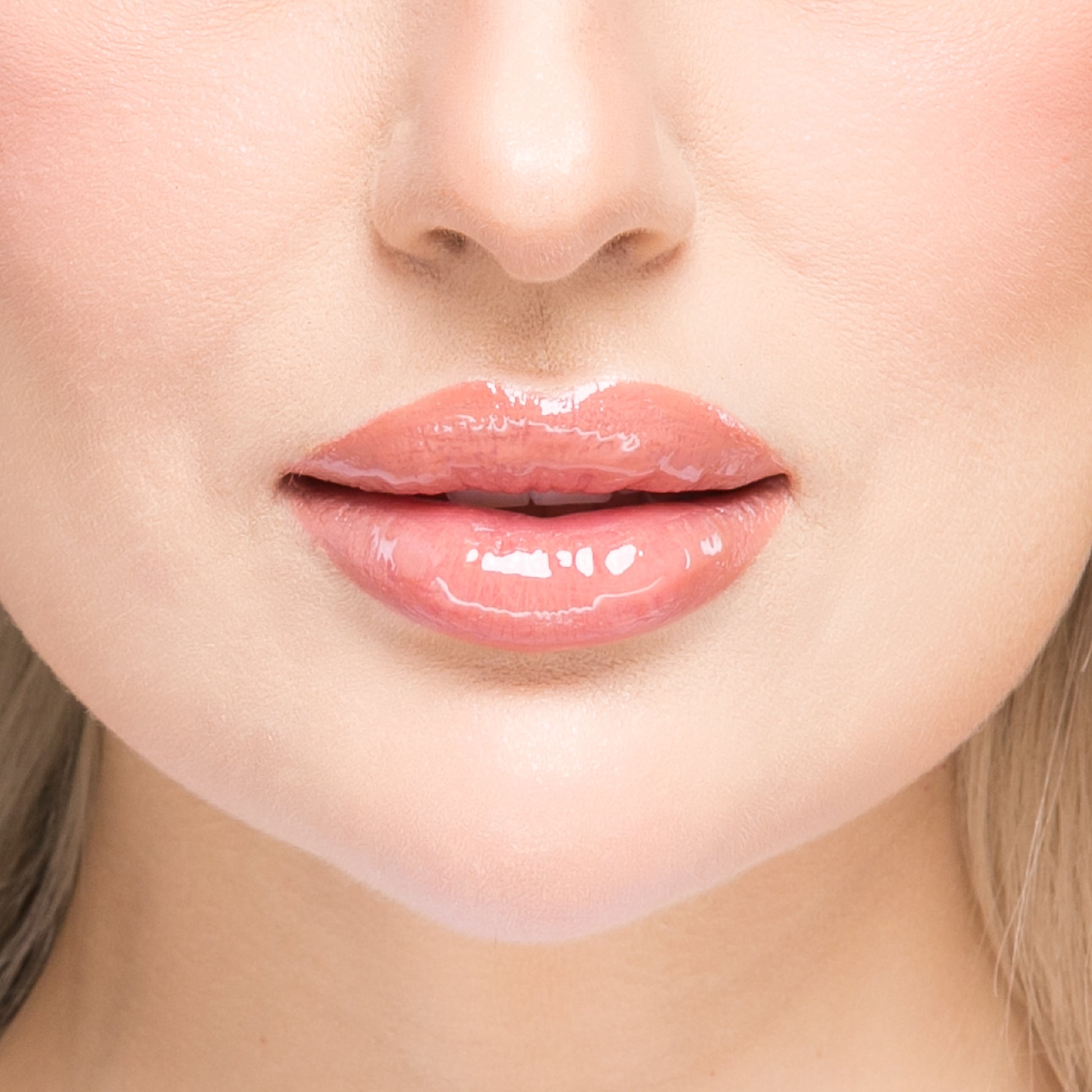 Results of the KrX Lip Plumping Gloss; visibly fuller, dimensionally plumper lips achieved through advanced Korean warming agents and deep-acting hydrators.