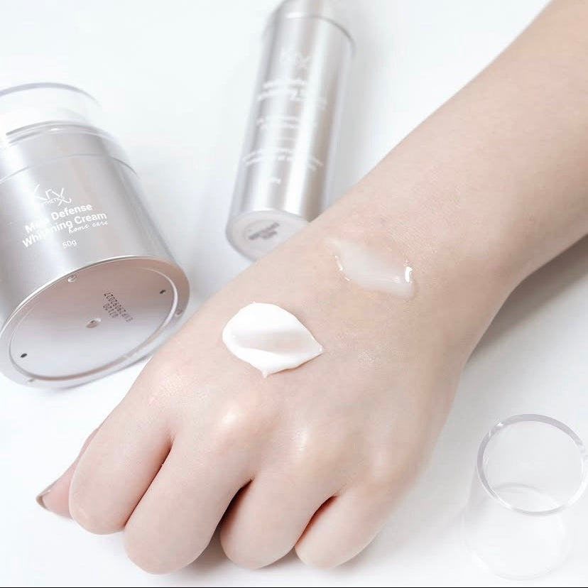 Applying the KrX Mela Defense Brightening Cream sample to target dark spots, melasma, and uneven skin tone for a clear complexion.
