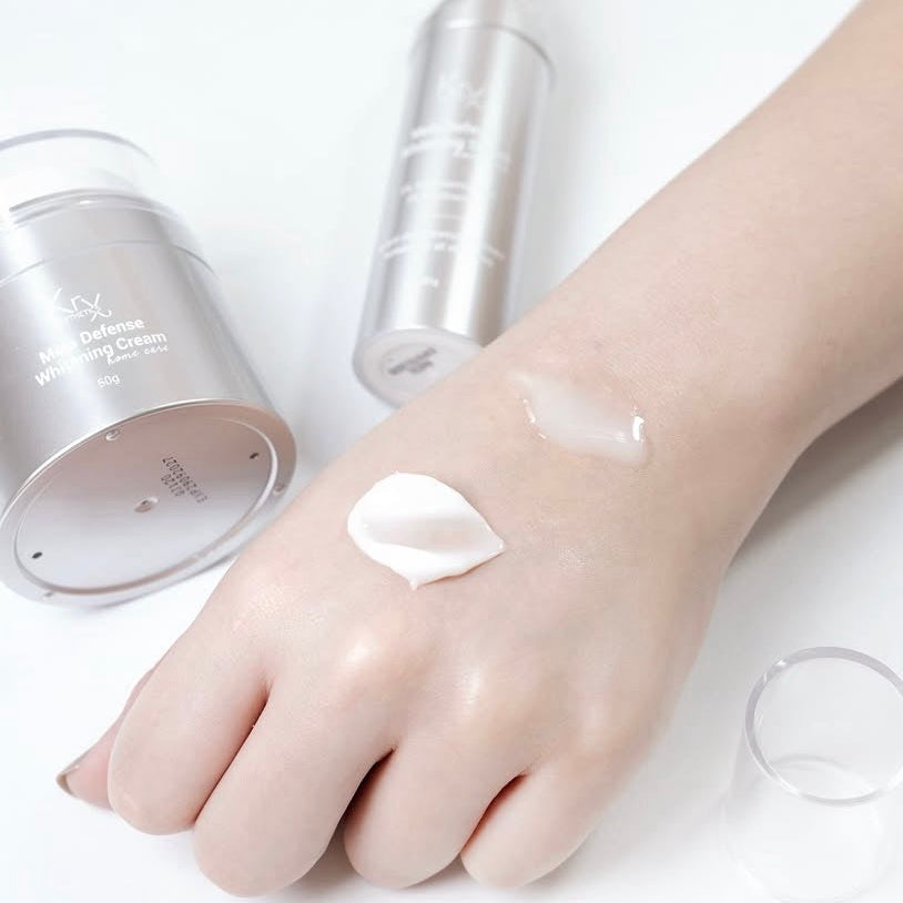 Applying the KrX Mela Defense Brightening Cream sample to target dark spots, melasma, and uneven skin tone for a clear complexion.