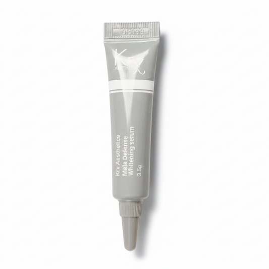 Trial-size KrX Mela Defense Serum sample, a 3.5g concentrated tube designed for testing the whitening and brightening effects on dark spots before committing to the full size