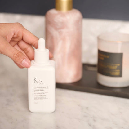 KrX Milk Boosting Serum; professional Korean barrier repair treatment for a luminous glass skin finish.