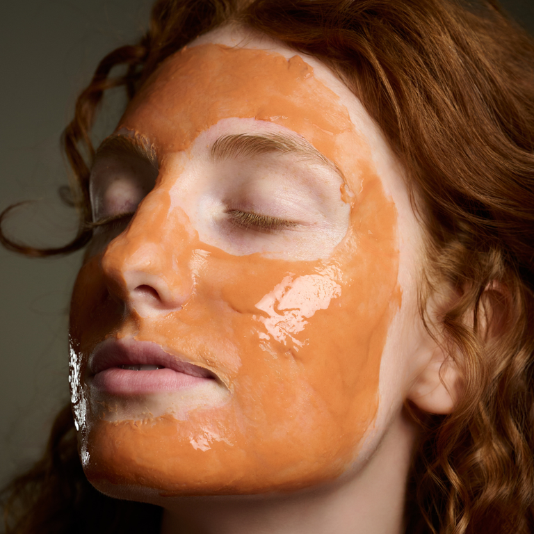 KrX Aesthetics Mud to Sheet Mask Kit on a model; a microbiome-friendly Korean treatment using Lactobacillus Ferment to balance and soothe acne-prone skin.