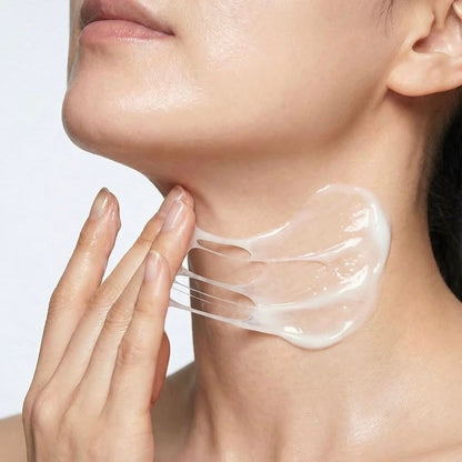 Applying a smooth layer of KrX Intensive Firming Korean Neck Cream upward from the décolletage to the jawline to target fine lines and crepey texture.