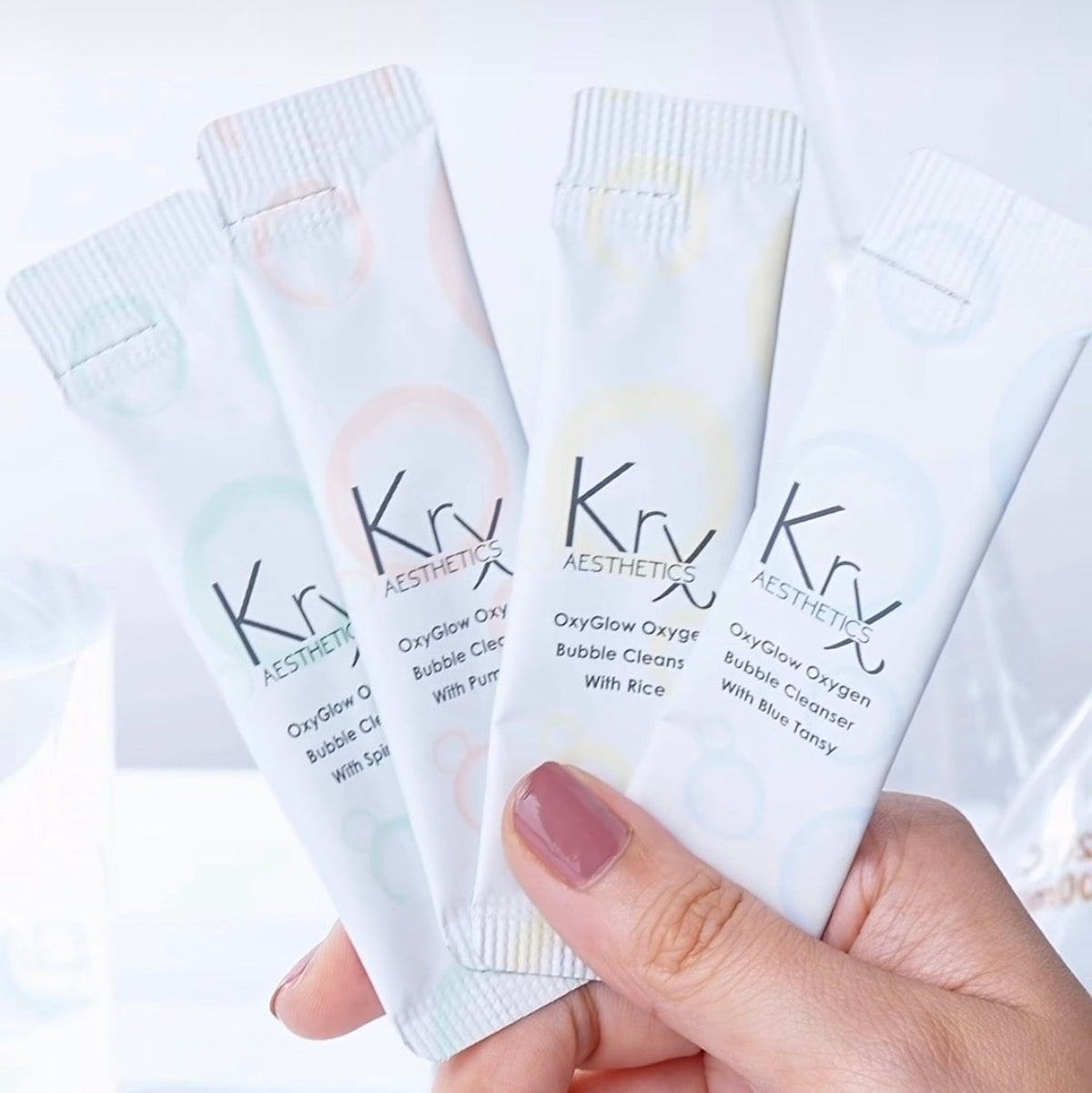 KrX OxyGlow oxygen bubble cleanser sachets showcasing convenient single-use Korean skincare packaging.