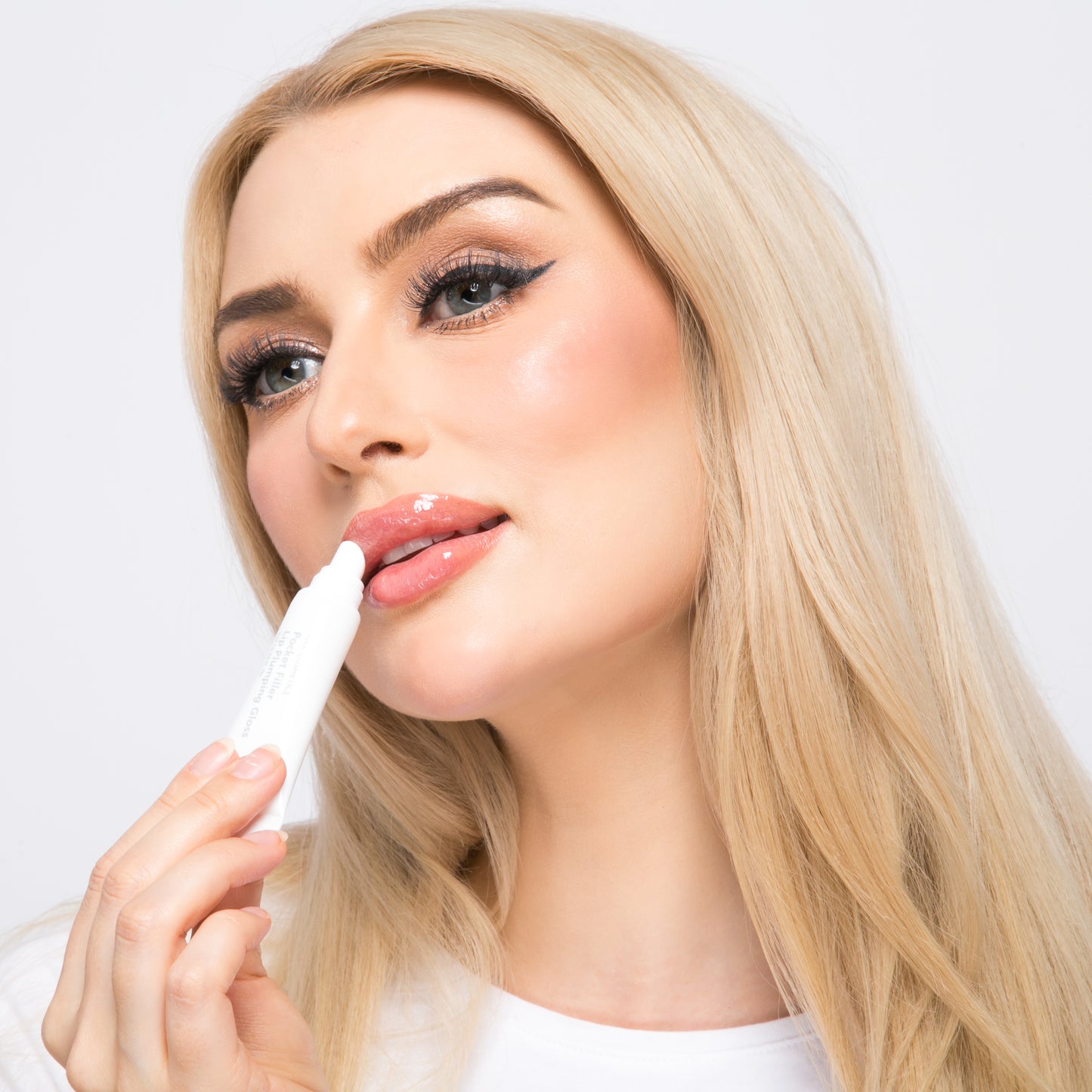 Professional application of KrX Pocket Filler Korean lip gloss; showing the instant smoothing effect on dehydrated lips and the radiant, healthy glow of K-Beauty lip technology.