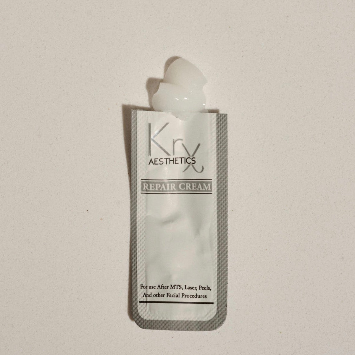 Individual travel-sized pouch of KrX Repair Cream designed for hygienic, on-the-go barrier support and sensitive skin recovery.