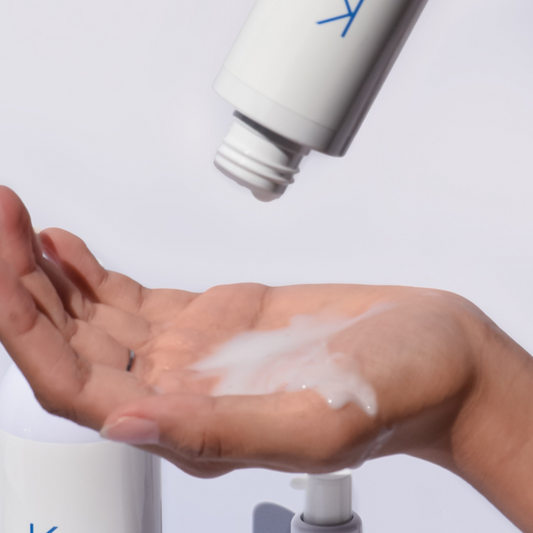 Opaque milky texture of KrX Probiotic Toner delivering intensive skin barrier hydration.