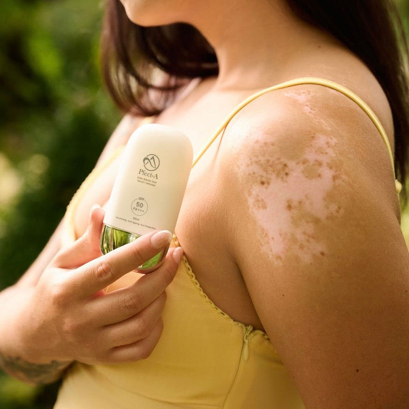 Pfect-A Solar Elixir Serum Sunscreen SPF 50 being applied to glowing skin; a professional Korean solution for rejuvenation without downtime that heals the skin barrier while providing maximum UV protection.