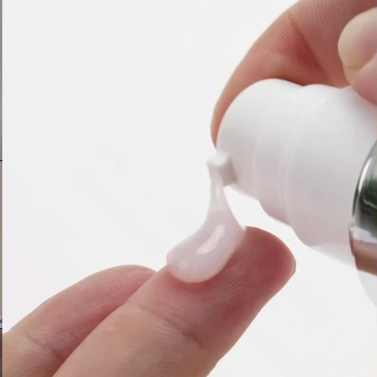 Applying KrX Face Lift Serum to clean skin to target fine lines and visible skin laxity.