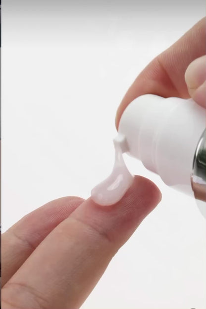 Applying KrX Face Lift Serum to clean skin to target fine lines and visible skin laxity.