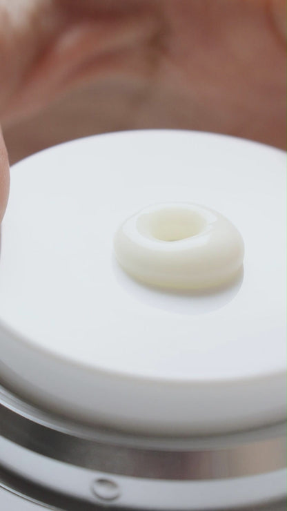 Application of KrX Mela Defense Cream featuring Tranexamic Acid and Niacinamide for even skin tone.