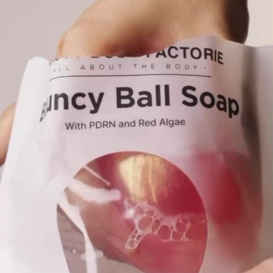 Korean PDRN bouncy ball soap for cellular body repair and deep hydration, featuring Sodium DNA and Red Algae for a firm, youthful glow.
