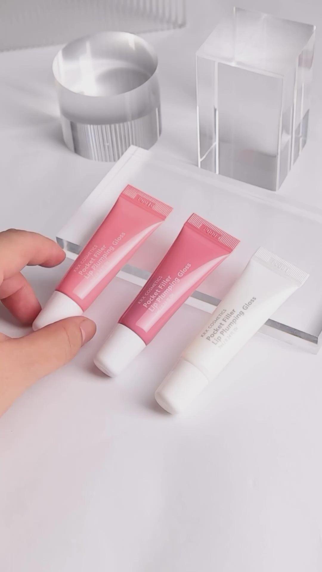 KrX Aesthetics Pocket Filler Lip Plumping Gloss collection in Red, Pink, and Clear; a professional Korean lip treatment that provides instant volume and a high-shine, glass-like finish.