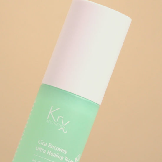 Hydrating Korean Cica toner being applied to the skin, showcasing the immediate 'bounce' and radiance provided by fermented antioxidants and Tremella Fuciformis.