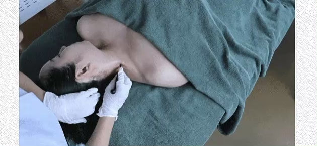 Demonstration of the Dermathod K-Beauty Miola tool on the neck; utilizing the small line edge to drain toxins and release muscular tension in anatomically curved areas.