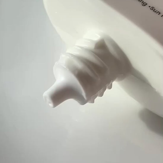 Close-up of the non-comedogenic Pfect-A Solar Elixir Serum, a hydrating Korean sunscreen that leaves a radiant, skin-like finish without clogging pores or triggering acne breakouts.