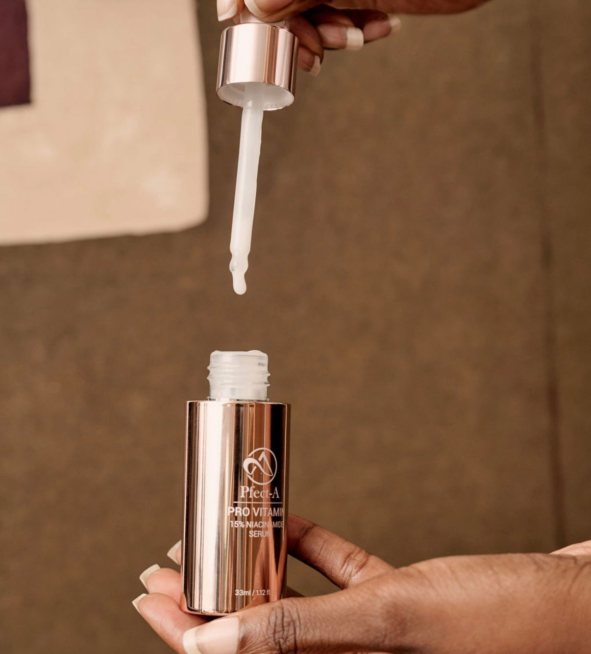Applying a professional-grade Korean niacinamide and ceramide serum to clear dark spots and improve skin clarity.