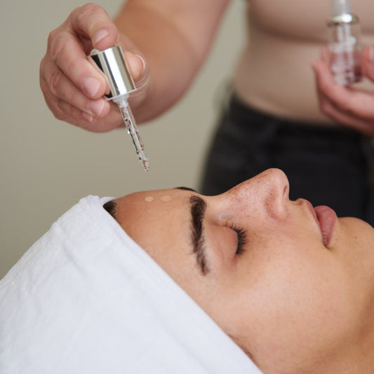 Professional application of NeoGenesis Beta-Glucan calming serum to reduce redness and post-procedure inflammation.