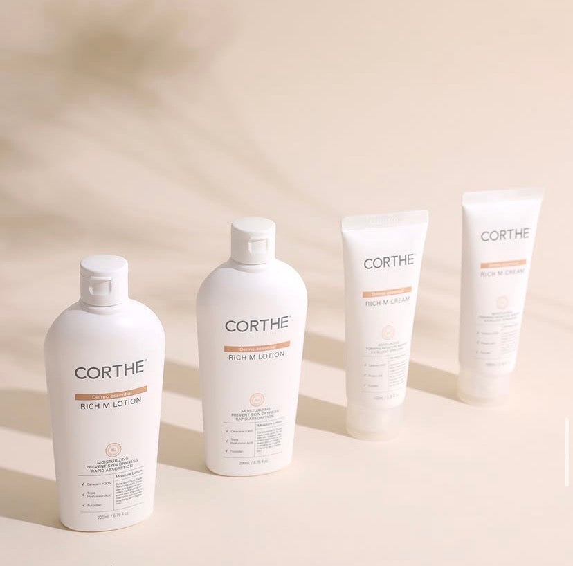 A luxury display of the Corthe Dermo Essential line, featuring the ceramide-powered Rich M Cream for a clinical-grade moisture ritual that deeply heals damaged skin and protects the skin barrier.
