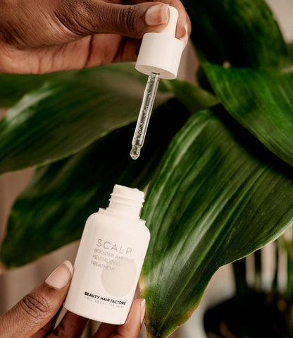 Dropper dispensing BHF Scalp Booster clear leave-in scalp serum featuring Salicylic Acid and 5-Peptide Complex for deep hair follicle and root health.