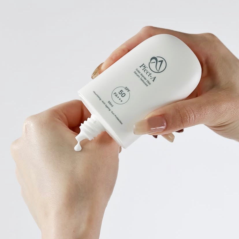 Applying the Pfect-A Solar Elixir from the bundle; a weightless, invisible Korean serum sunscreen that provides SPF 50+ protection with zero white cast.