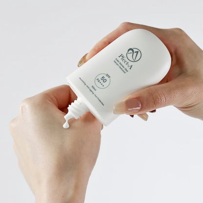 Applying the Pfect-A Solar Elixir from the bundle; a weightless, invisible Korean serum sunscreen that provides SPF 50+ protection with zero white cast.