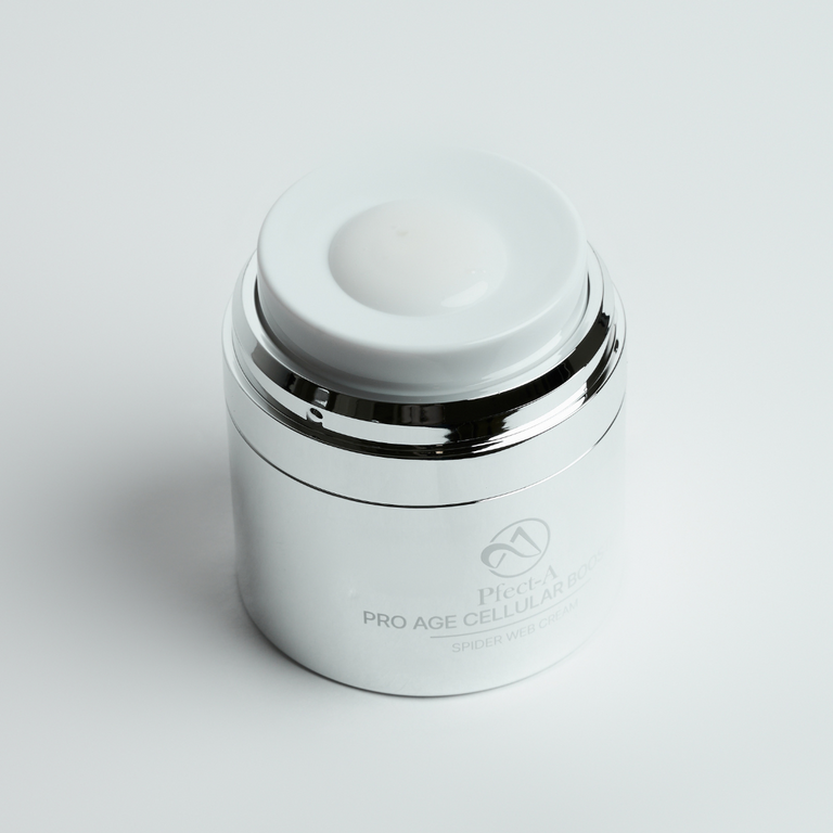 Pfect-A Spider Web Cream presented with its key botanical actives, including apple stem cells and lotus leaf extract for advanced antioxidant protection and skin longevity.