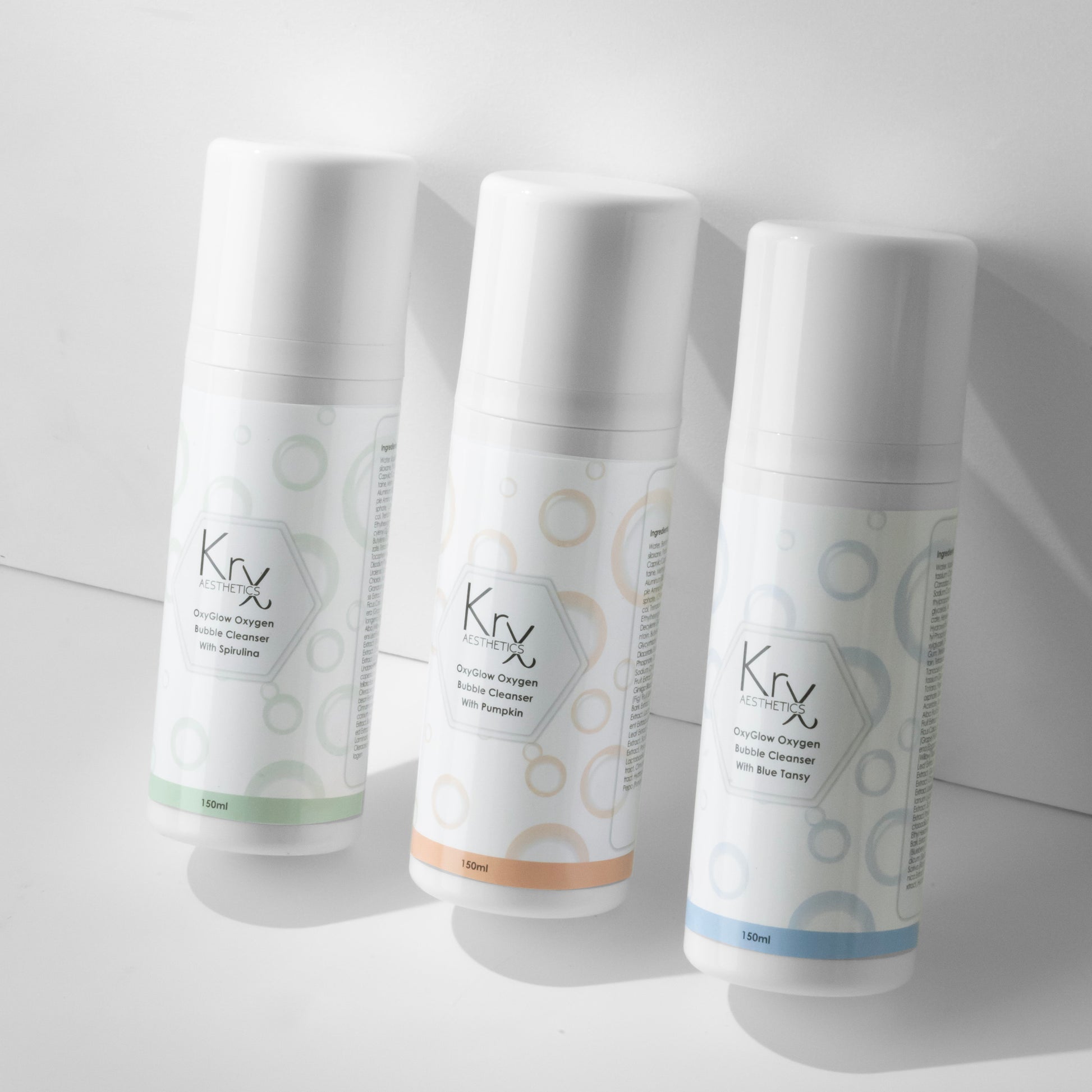 KrX OxyGlow Trio for hormonal skin cycling; a versatile solution that solves "cyclical skin changes" by allowing you to switch between exfoliating Pumpkin, detoxifying Spirulina, and calming Blue Tansy as your skin's needs shift throughout the month.