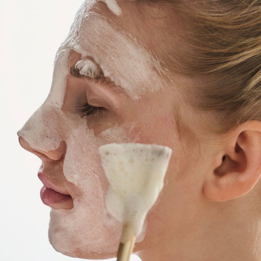 Applying Thesera Epidermis Balance Korean glycolic acid foam cleanser to cheeks to exfoliate dead skin and refine texture.