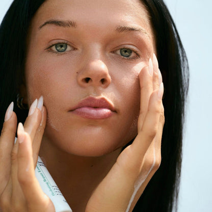 Applying gentle Thesera Hydrating Repair Essence to calm post-laser redness, stinging, and skin barrier reactivity.